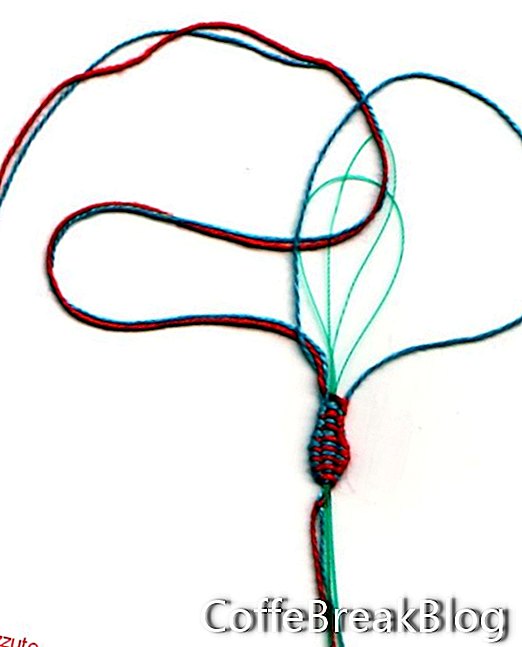 два кольорових ключі, що показують 2 нитки на голках через 2 нитки для нитки