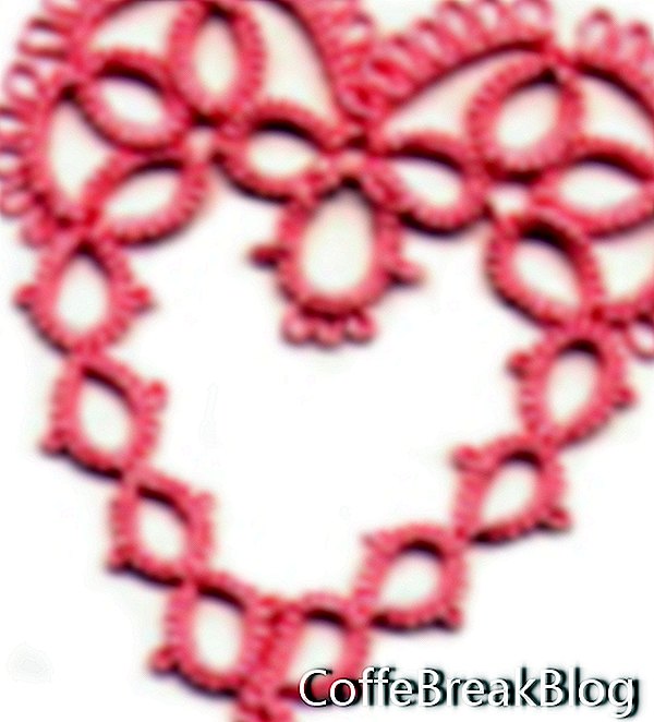 Логотип в виде сердца с разрезным кольцом от Georgia Seitz